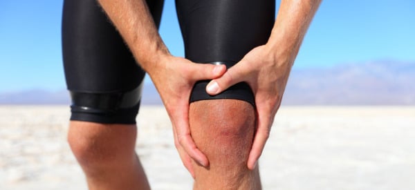 Injuries - sports running knee injury on man
