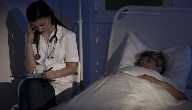 Image of medic diagnosing sick elderly woman