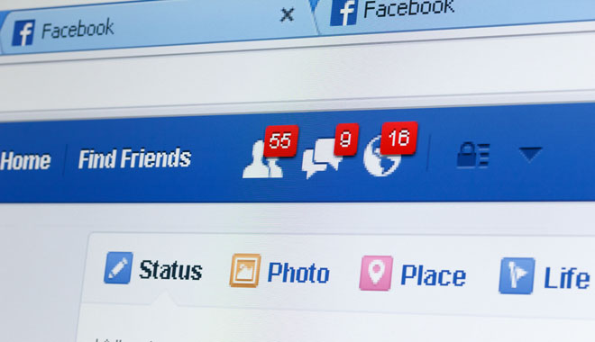 KIEV, UKRAINE - June 8: Facebook web page closeup with notifications of new friends request and messages, and blank status line, in Kiev, Ukraine, on June 8, 2014.