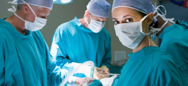 Four Surgeons Getting Ready To Operating On A Patient