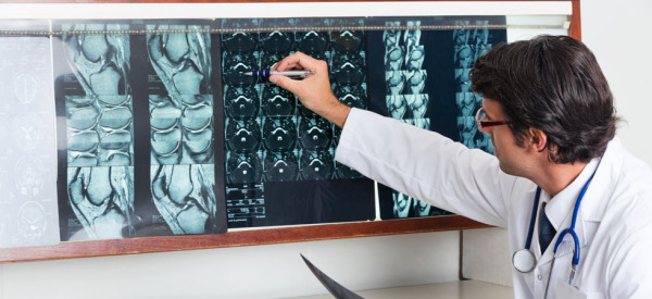 Radiologist Reviewing X-ray At Clinic