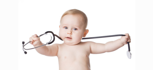 Sweet baby with stethoscope on a white background. Adorable baby