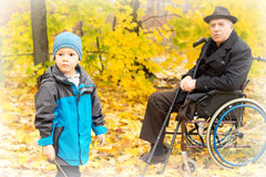 http://www.dreamstime.com/royalty-free-stock-photos-little-boy-his-handicapped-grandfather-sitting-wheelchair-holding-crutches-enjoying-day-nature-together-playing-image34581708