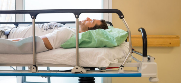 Patient Lying On Bed In Hospital