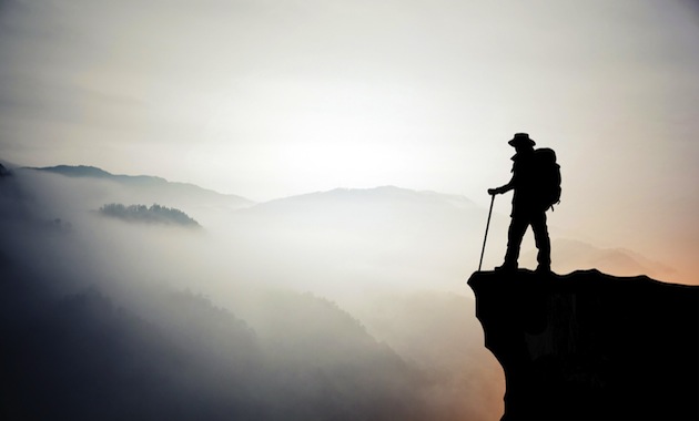 Silhouette of hiking man in mountain
