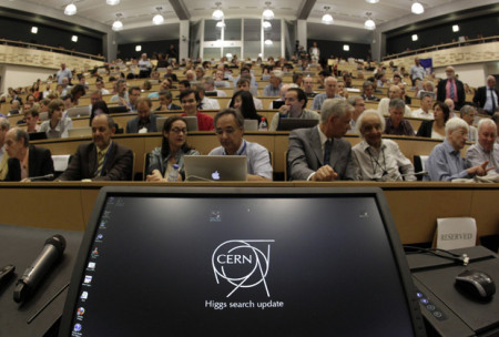 Participants wait on July 4, 2012 before the opening of a seminar to deliver the latest update in the 50-year bid to explain a riddle of fundamental matter in the search for a particle called the Higgs boson at the European Organization for Nuclear Research (CERN) in Meyrin, near Geneva. AFP PHOTO / POOL / DENIS BALIBOUSEDENIS BALIBOUSE/AFP/GettyImages