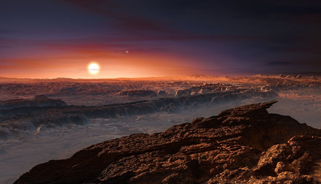 This artist’s impression shows a view of the surface of the planet Proxima b orbiting the red dwarf star Proxima Centauri, the closest star to the Solar System. The double star Alpha Centauri AB also appears in the image to the upper-right of Proxima itself. Proxima b is a little more massive than the Earth and orbits in the habitable zone around Proxima Centauri, where the temperature is suitable for liquid water to exist on its surface.