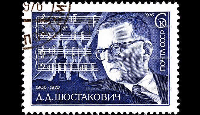 USSR- CIRCA 1976: A stamp printed in the USSR shows a portrait of the Russian composer Dmitri Shostakovich and the score for his 7th Symphony, circa 1976.