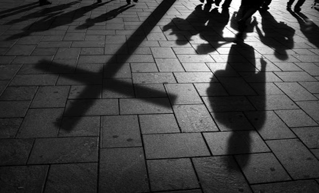shadow of a person on the pavement