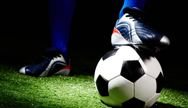 Horizontal image of soccer ball and shoes