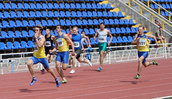 Unidentified men at the finish of the 200 meters race on the Ukrainian Track & Field Championships on June 01, 2012 in Yalta, Ukraine.